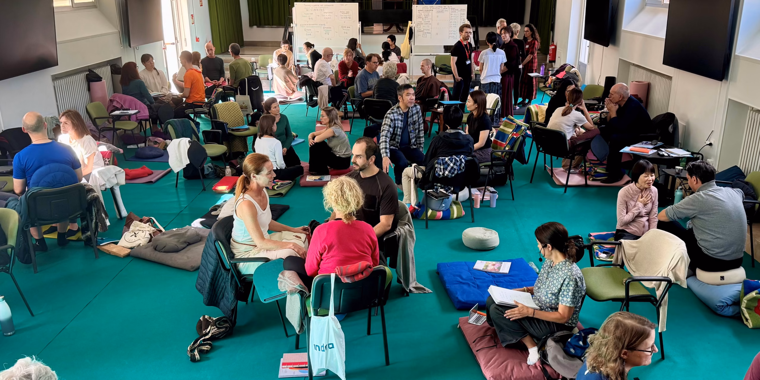 photo of a group of people talking to each other