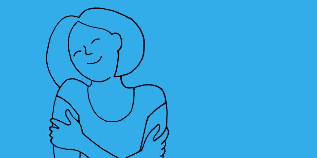 Woman hugging herself